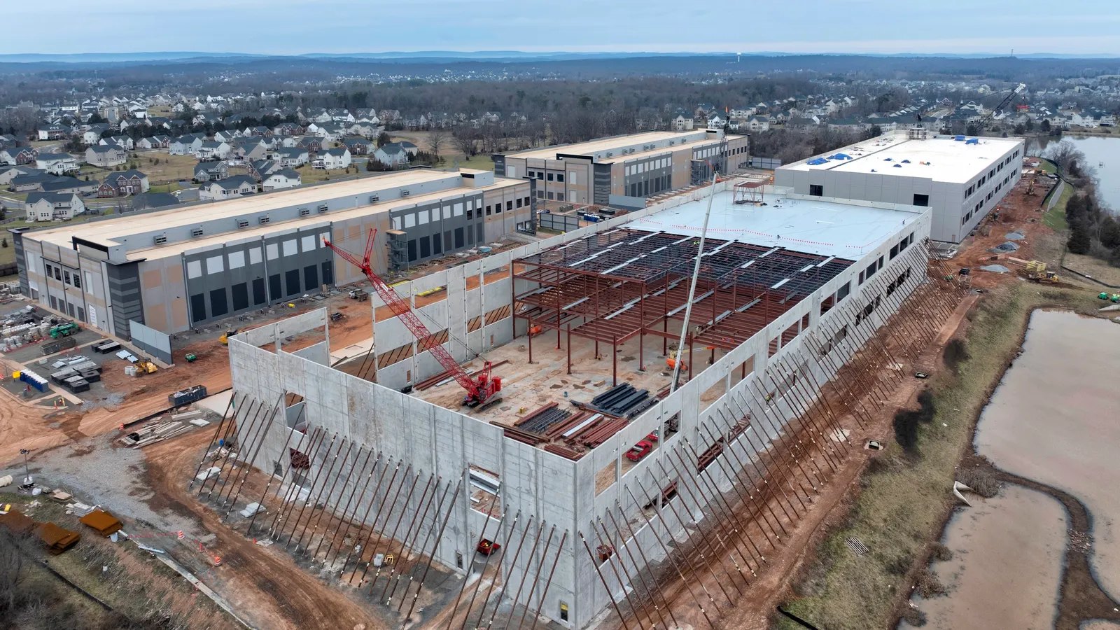 Precast halls going up, steel on the roof